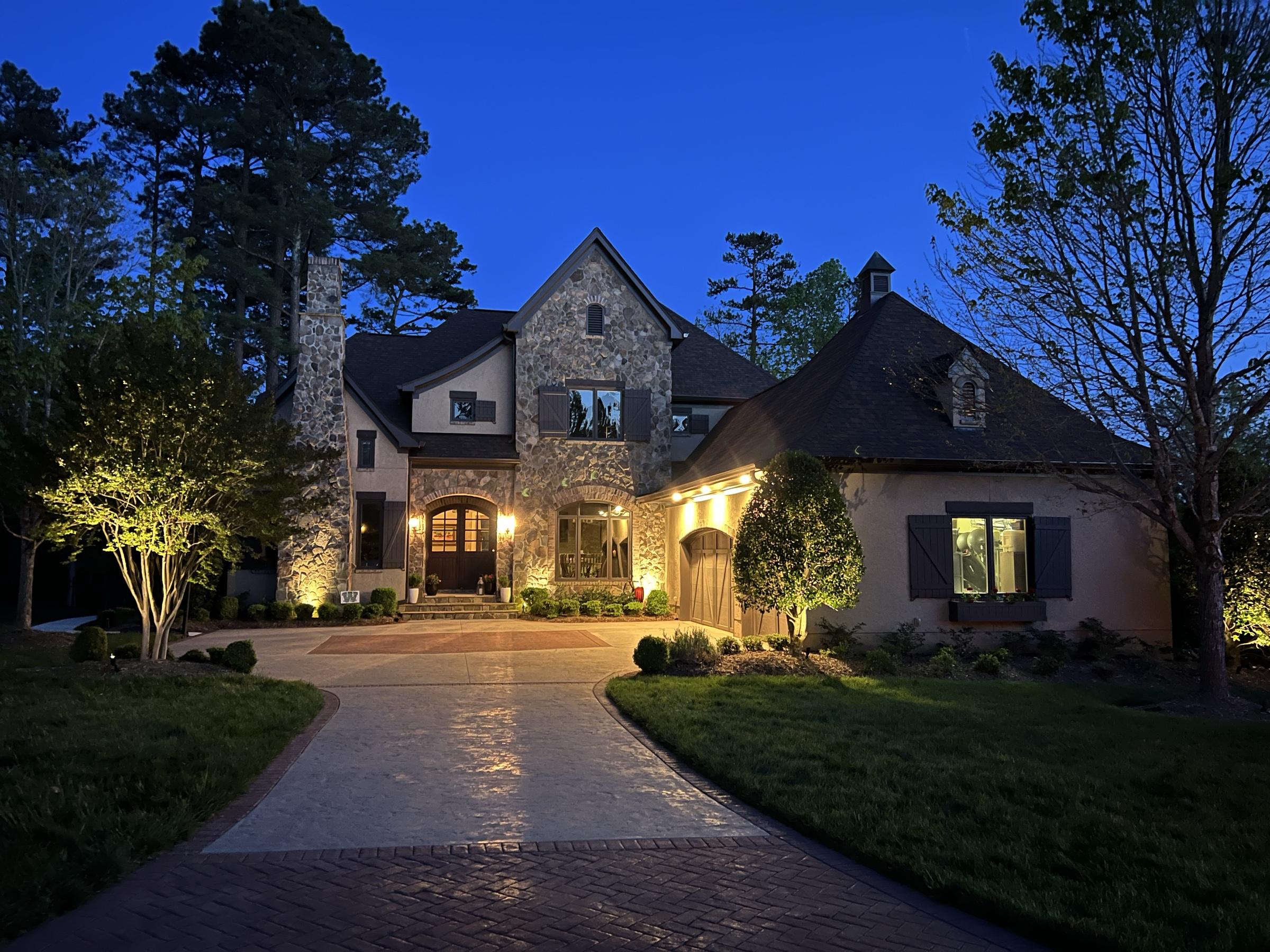 Home at twilight, lights on